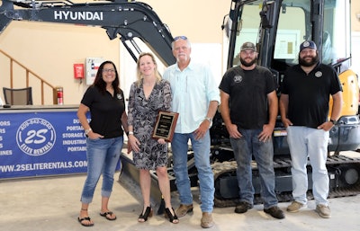 elite equipment leadershpi in front of hyundai machine