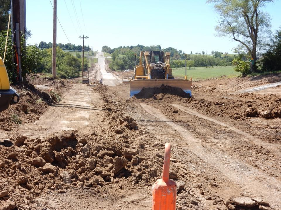 Caterpillar dozer grading a new road