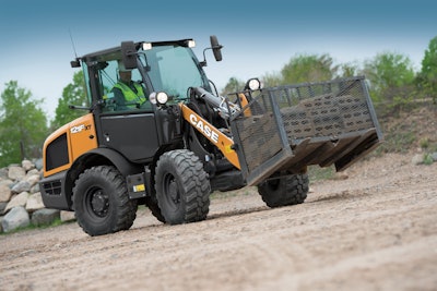 CASE 121F compact wheel loader carrying bricks