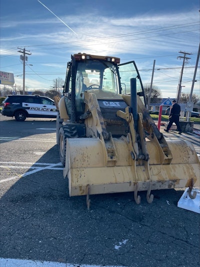 Cat backhoe in parking lot used to steal ATM in Puyallup Washington