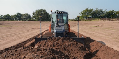 Develon Dozer equipped with Leica 3D machine control pushing dirt