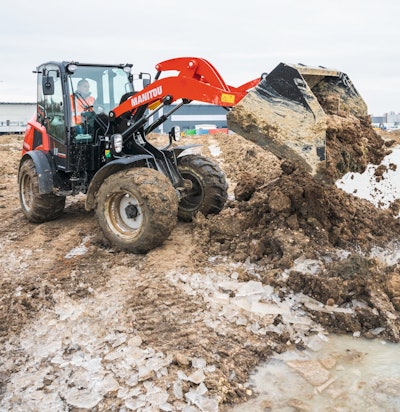 Manitou MLA 6-6.5 compact wheel loader dumping mud