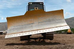 Track loader with tilted dozer blade