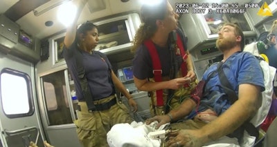 Trevor Kilgore in ambulance after rescued from trench collapse in Iowa