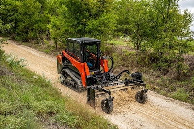 Kubota SVL50x gompact track loader grading a path