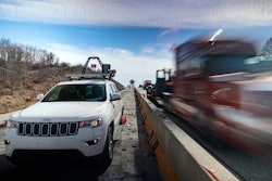 trucks drives through work zone