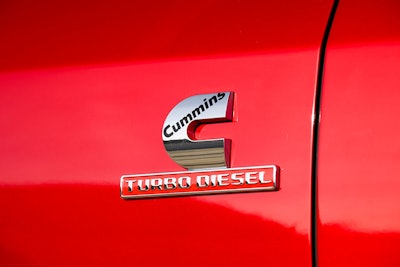 cummins turbo diesel logo closeup on red 2025 Ram HD 2500