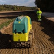 Construction worker operating an Ammann ARR 1575-2 Trench Roller