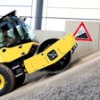 man drives a bomag bw 177 bvo up a small hill