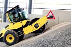 man drives a bomag bw 177 bvo up a small hill