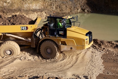 Cat 745 dump truck in thick mud