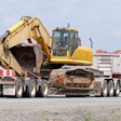 Semi hauling an excavator