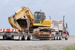 Semi hauling an excavator