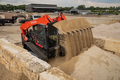 Kubota svl97-3 compact loader dumping sand