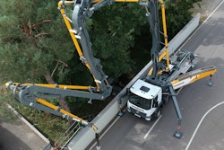 Liebherr 38 XXT truck mount concrete pumper Z-fold boom on road