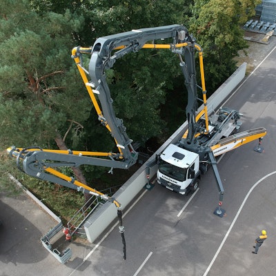 Liebherr 38 XXT truck mount concrete pumper Z-fold boom on road