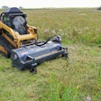 Loftness flail mower attachment on a compact track loader