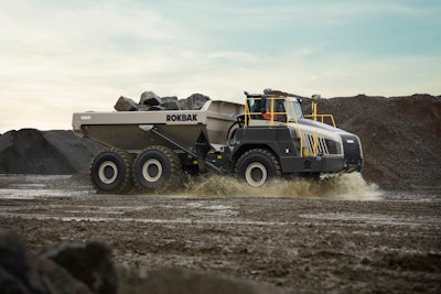 Rokbak RA40 dump truck loaded with rocks on dirt road