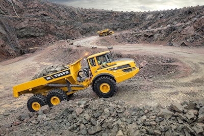 Volvo A45G dump trucks on dirt rocky road