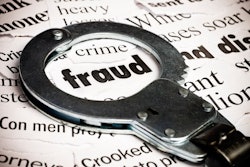 a handcuff highlights the word 'fraud' on a sheet of paper