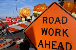 a road work ahead sign on a jobsite