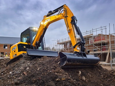 JCB 55z excavator on dirt pile