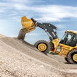 John Deere 644 P-Tier Wheel Loader dumping gravel