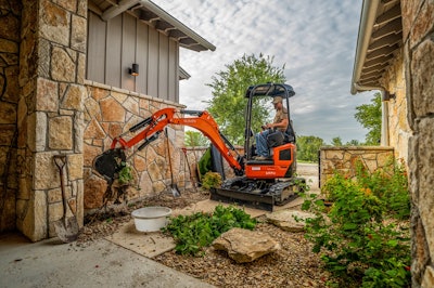 Kubota U17-5 Mini Excavator working in between houses