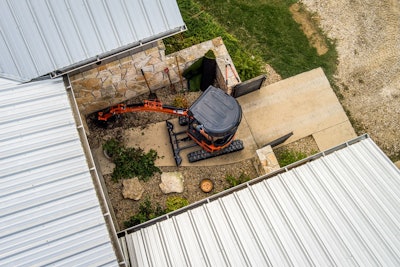 aerial view Kubota-U17-5 Mini Excavator is small landscaped area by house