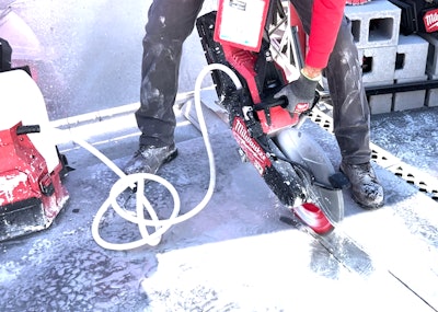 Milwaukee Tool cordless 14' Cutoff Saw cutting through concrete