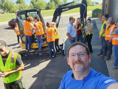 Gus Schmid with new John Deere 35G mini excavator for Johnsburg high
