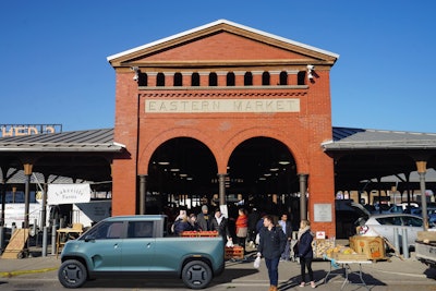 TELO Mt1 electric pickup parked in front of Eastern MArket building