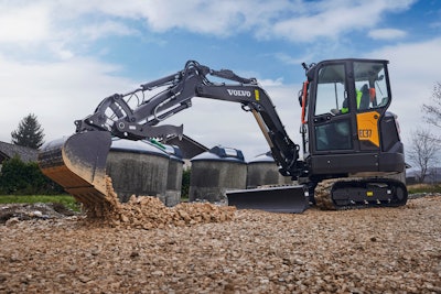 Volvo EC37 Compact Excavator dumping gravel