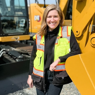 amanda cornelson leans on a machine