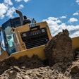 a caterpillar dozer moves dirt