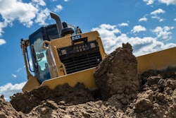 a caterpillar dozer moves dirt