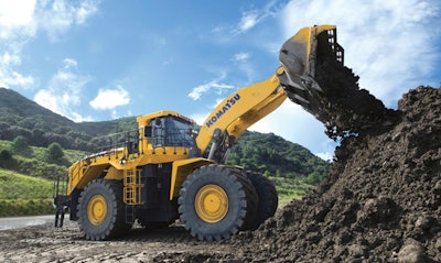a komatsu wheel loader moves dirt