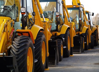 a lineup of yellow construction machines