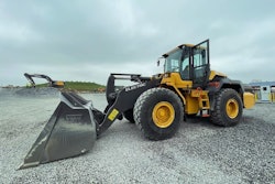 a volvo wheel loader parked on gravel lot
