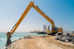 Cat 395 LRE Super Long Reach Excavator dredging a waterway