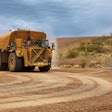 Cat 789D autonomous water truck on a haul road