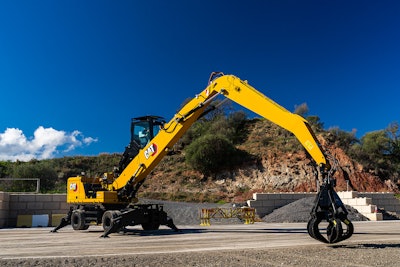 Cat MH3032 Material Handler stationary on gravel lot