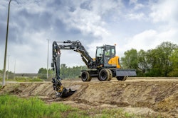 Hyundai HW100A wheeled excavator grading a ditch