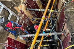 Emergency responders work to rescue workers trapped in trench collapse in Michigan