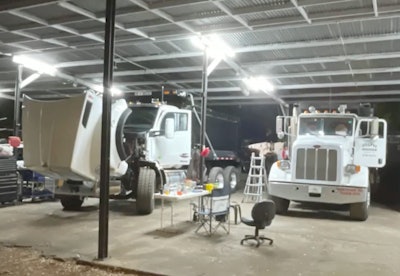 white trucks in garage at night at Florida chop shop