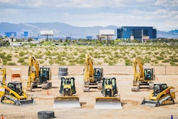 machines lined up in a sandbox