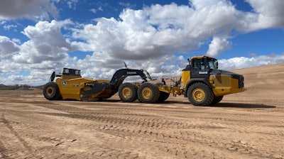 Deere 3812 Direct Hitch Scraper on a 460 P-Tier Articulated Dump Truck