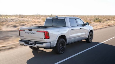 2026 Ramcharger EV pickup driving on desert highway
