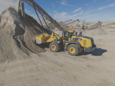 Komatsu WA485-11 wheel loader loading at dirt pile in quarry