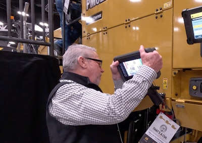 man removes display from mount